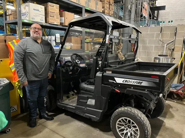Skyward team member with a utility vehicle inside a client warehouse