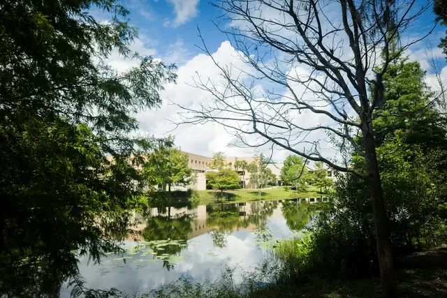 Office park buildings reflected in a pond