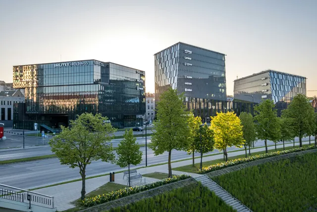 Tree-lined business district with office buildings